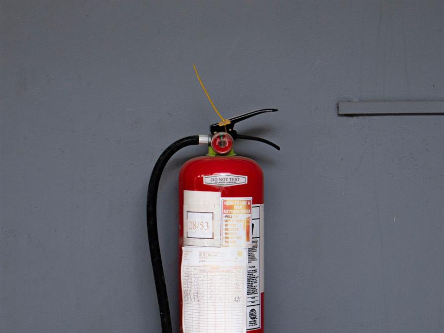 Wall-mounted fire extinguisher