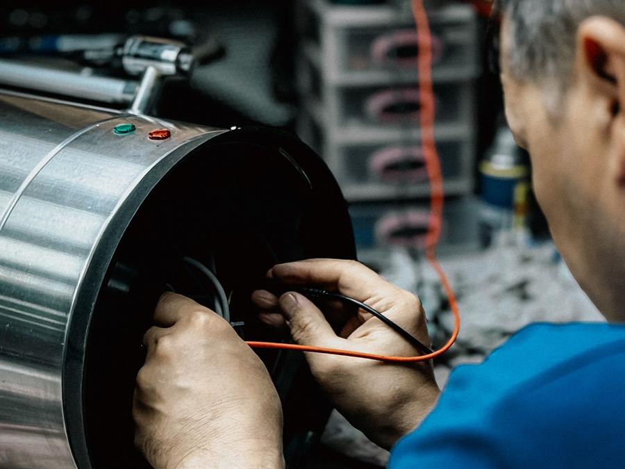 Technician testing equipment with a meter